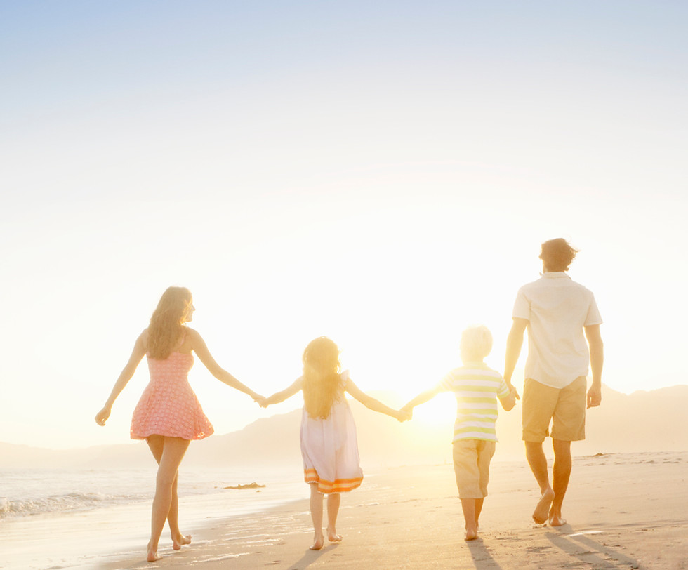 Family Walking On the Beach