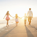 Family Walking On the Beach