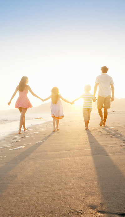 Family Walking On the Beach