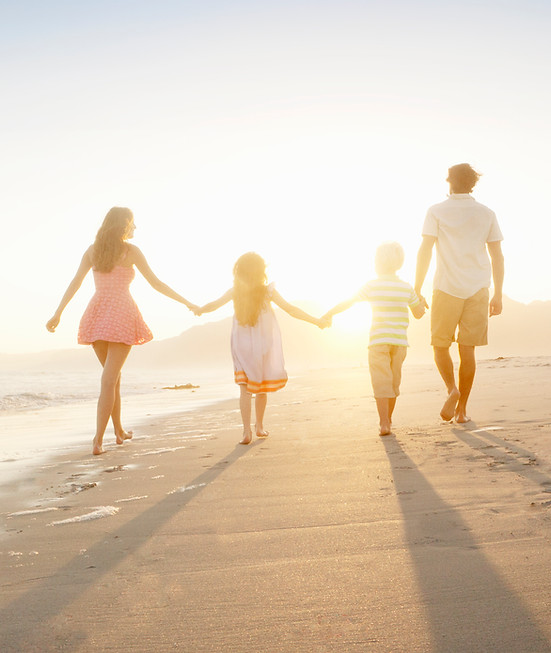 Family Walking On the Beach