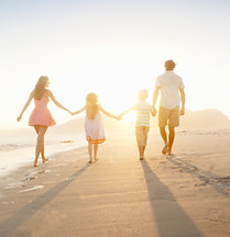 Family Walking On the Beach