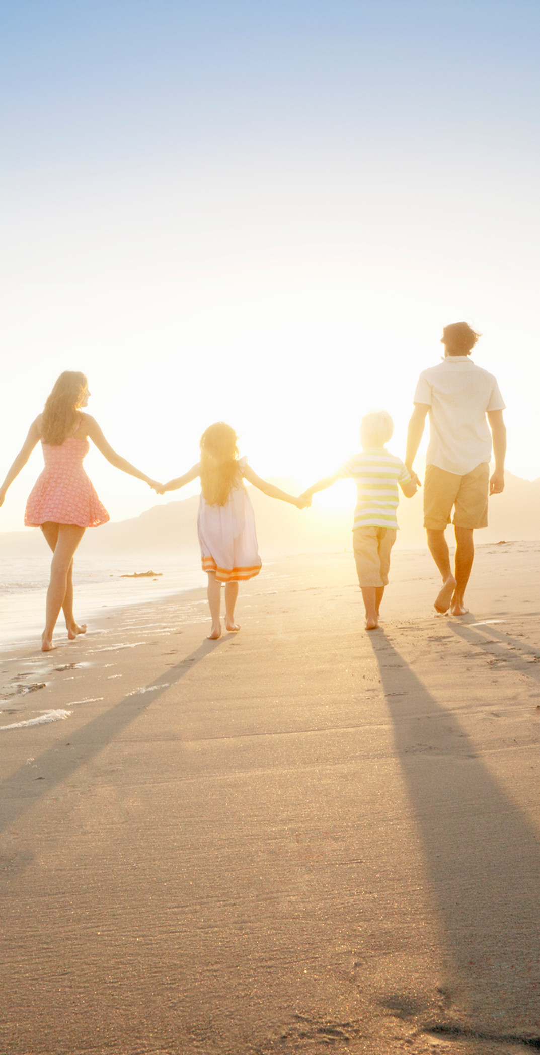 Family Walking On the Beach