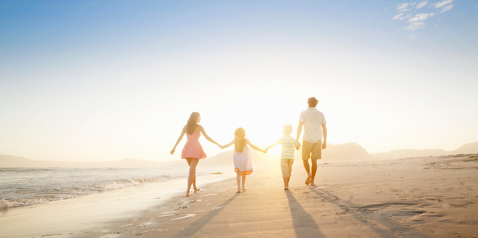 Family Walking On the Beach