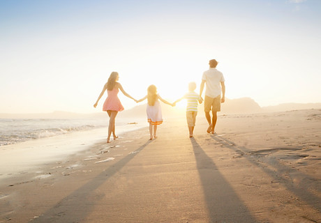 Family Walking On the Beach