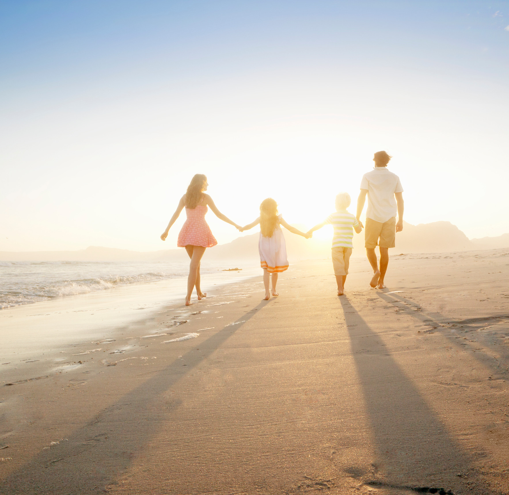 Family Walking On the Beach