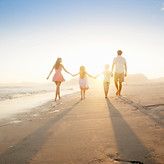 Family Walking On the Beach