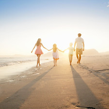 Family Walking On the Beach