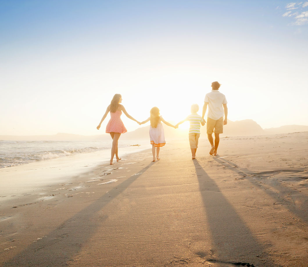 Family Walking On the Beach
