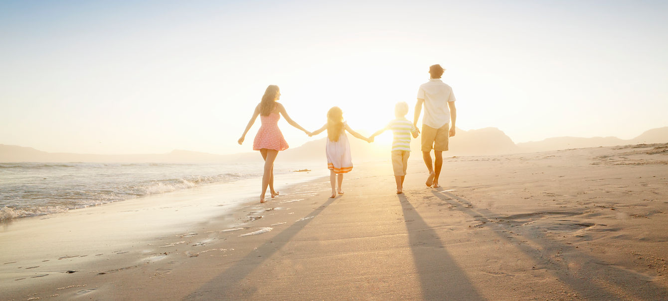 Family Walking On the Beach