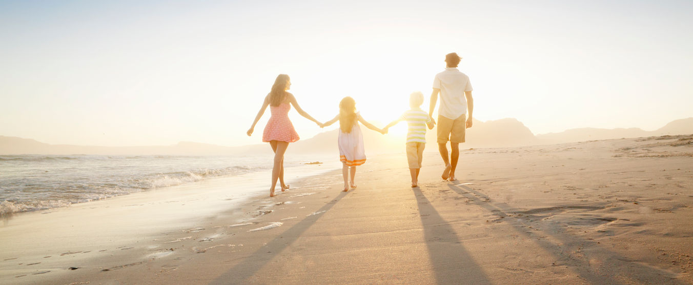 Family Walking On the Beach