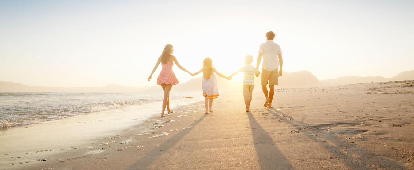 Family Walking On the Beach
