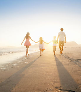 Family Walking On the Beach