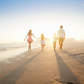 Family Walking On the Beach