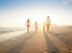 Family Walking On the Beach