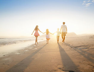Family Walking On the Beach