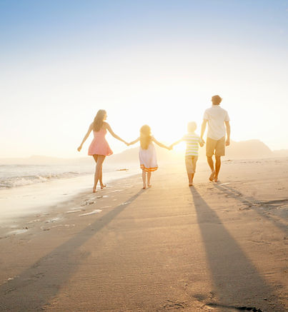 Family Walking On the Beach