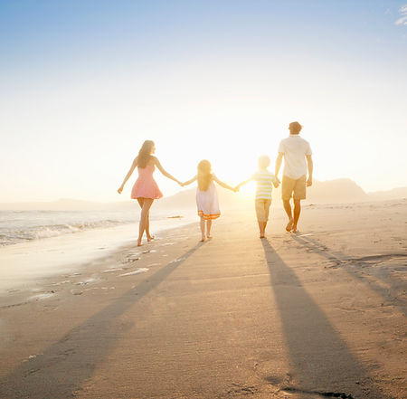Family Walking On the Beach