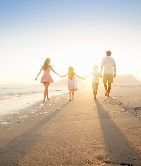 Family Walking On the Beach