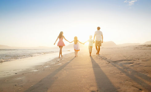 Family Walking On the Beach