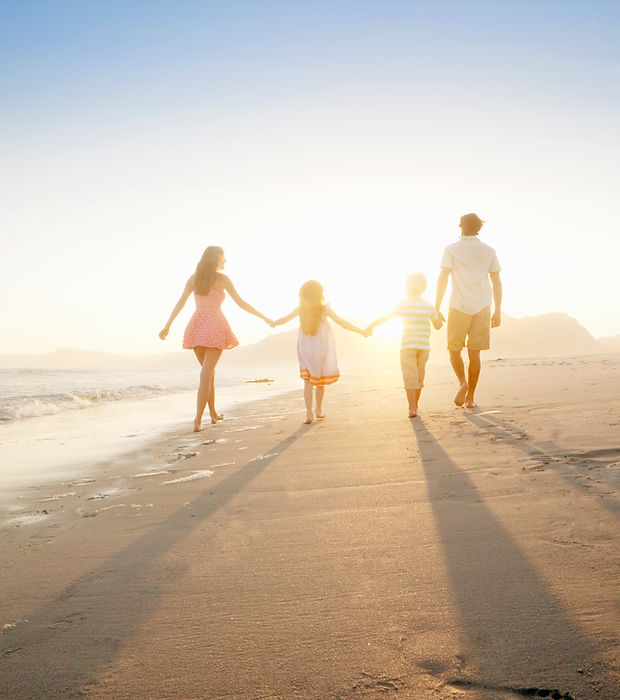 Family Walking On the Beach