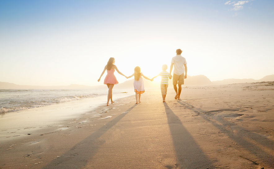 Family Walking On the Beach