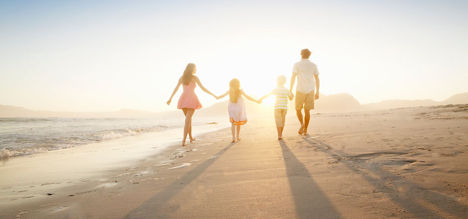 Family Walking On the Beach