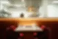 One of Caper's dining tables with a panaromic view of the kitchen