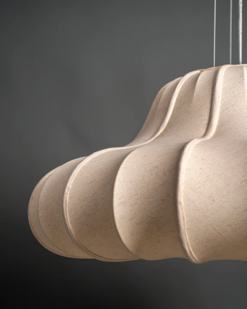 Close-up view of the unlit ORBIT fabric pendant lamp, highlighting its minimal texture perfect for luxury rooms.