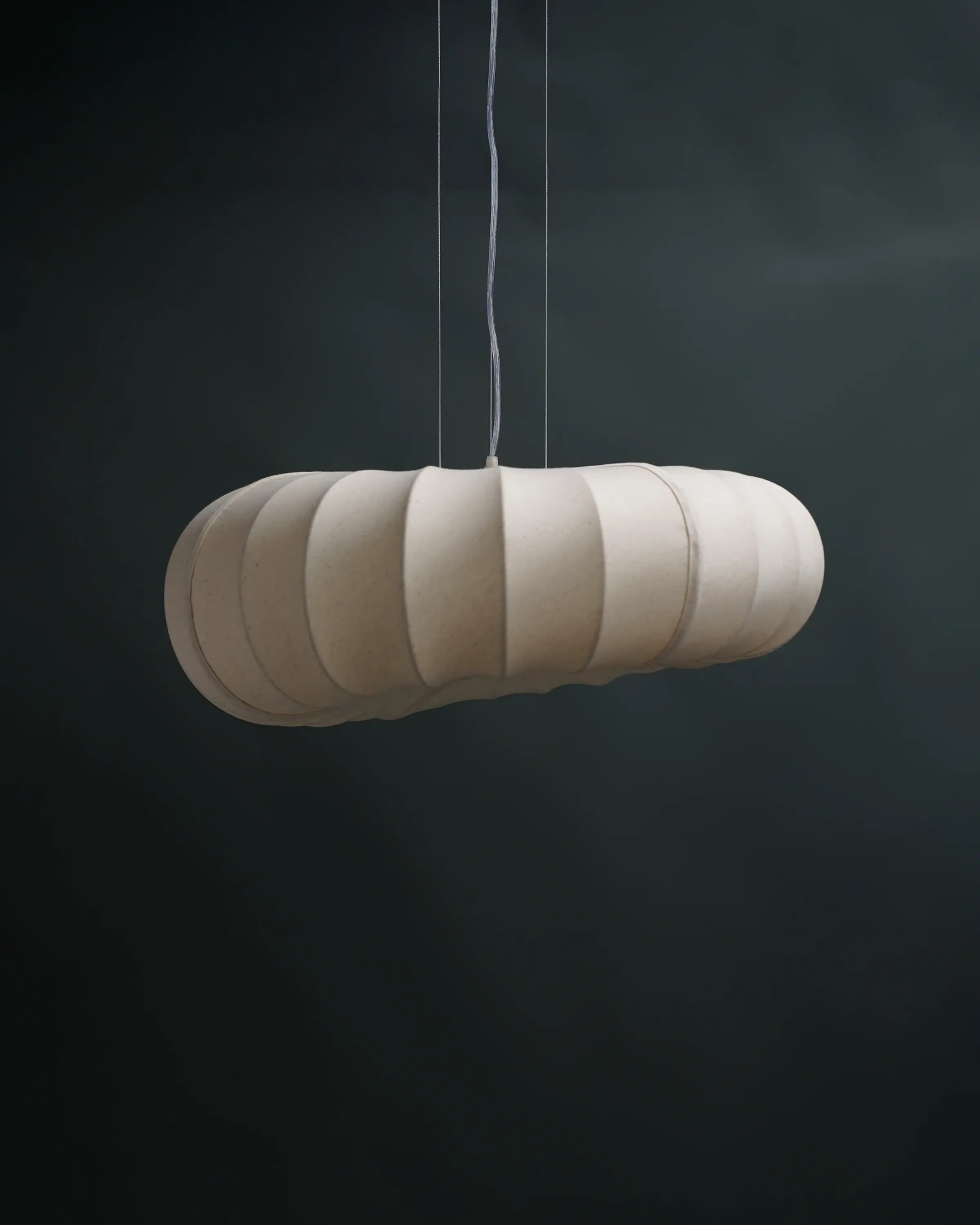 Straight-on view of the unlit POLO ceiling light, highlighting the clean structural lines of its compact form.