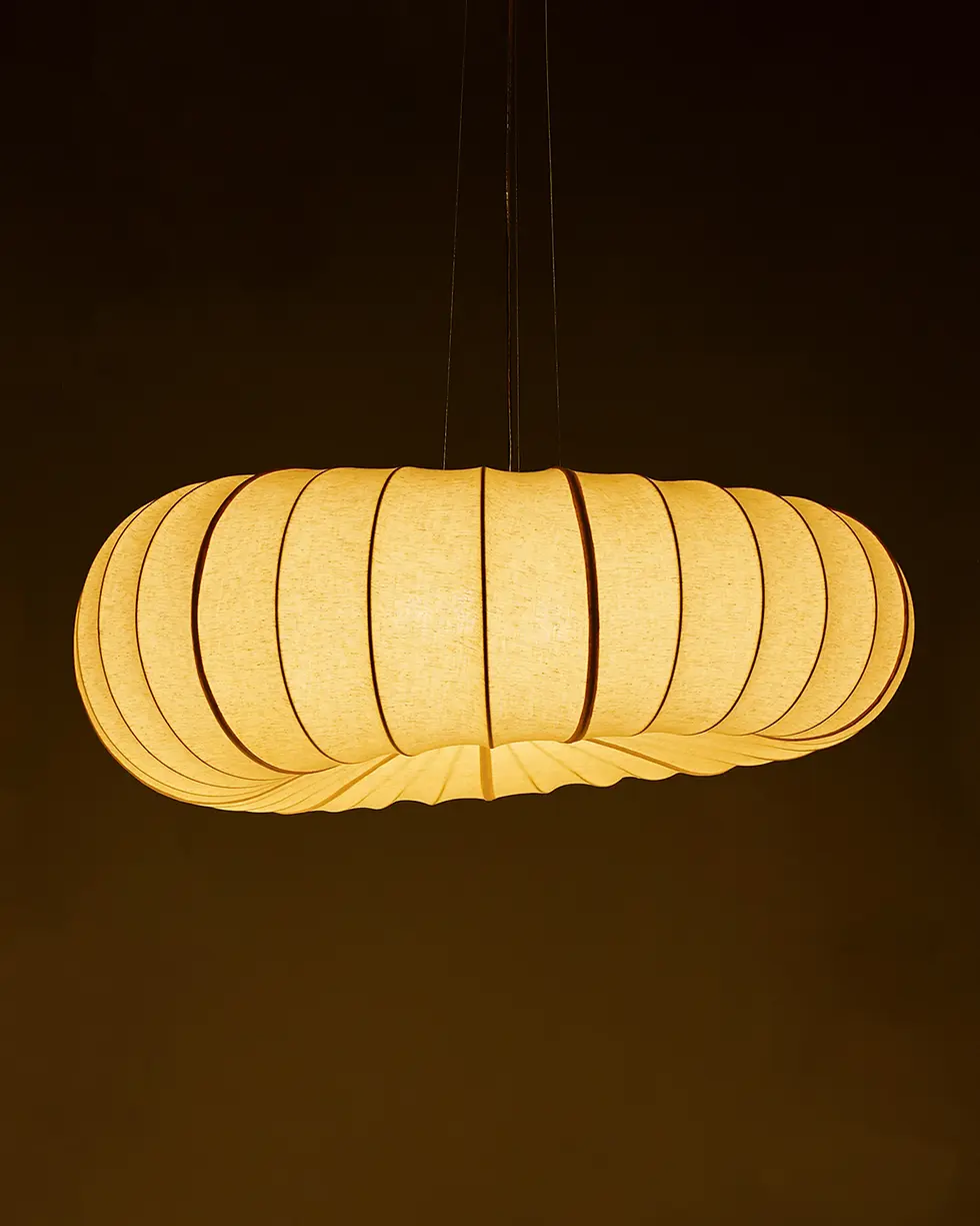 Thumbnail: Close-up of the lit large POLO hanging light from an angle, highlighting its donut-shaped organic silhouette.