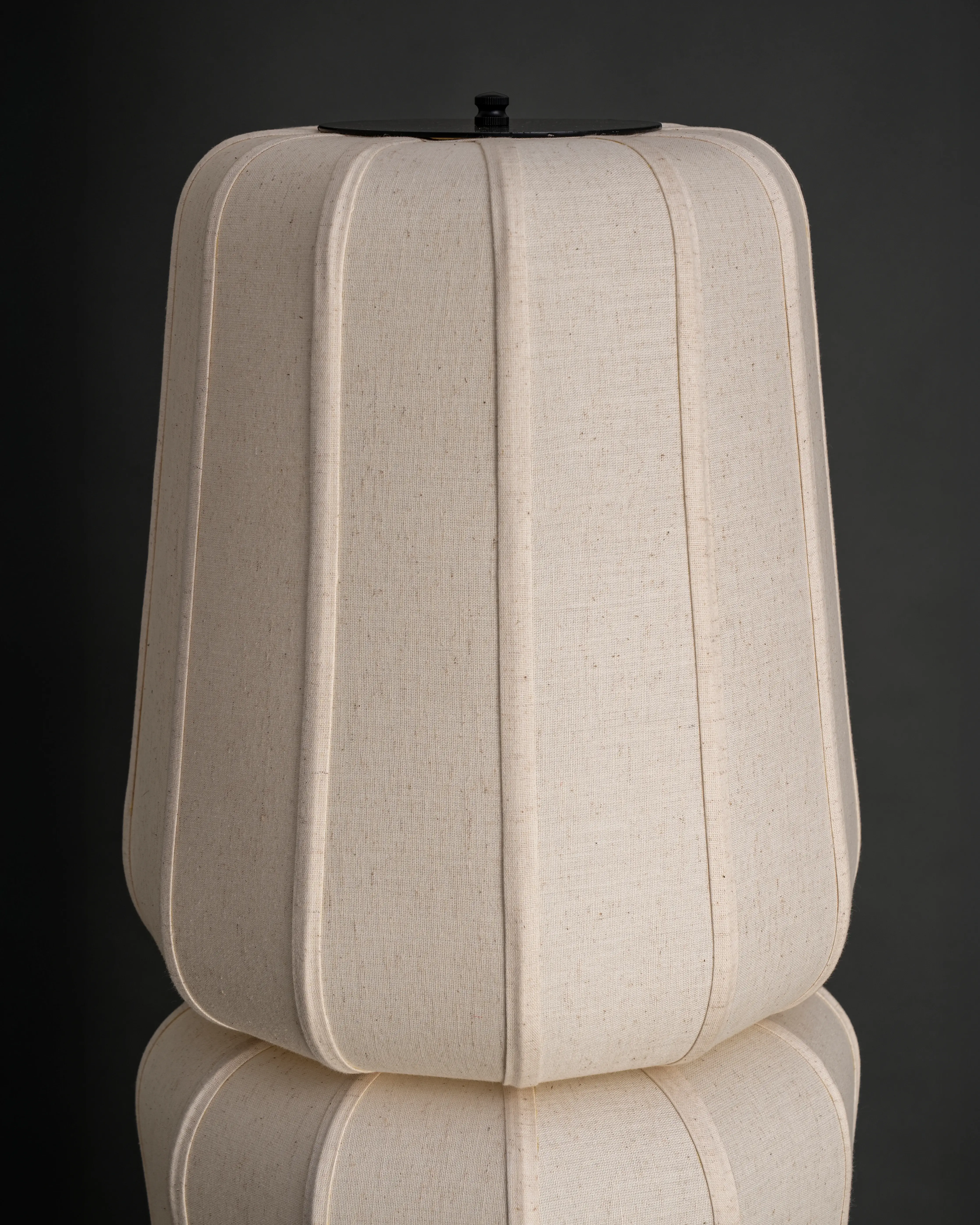Close-up view of the modern fabric TOTEM Floor Lamp shade, showcasing its elegant stacked forms.