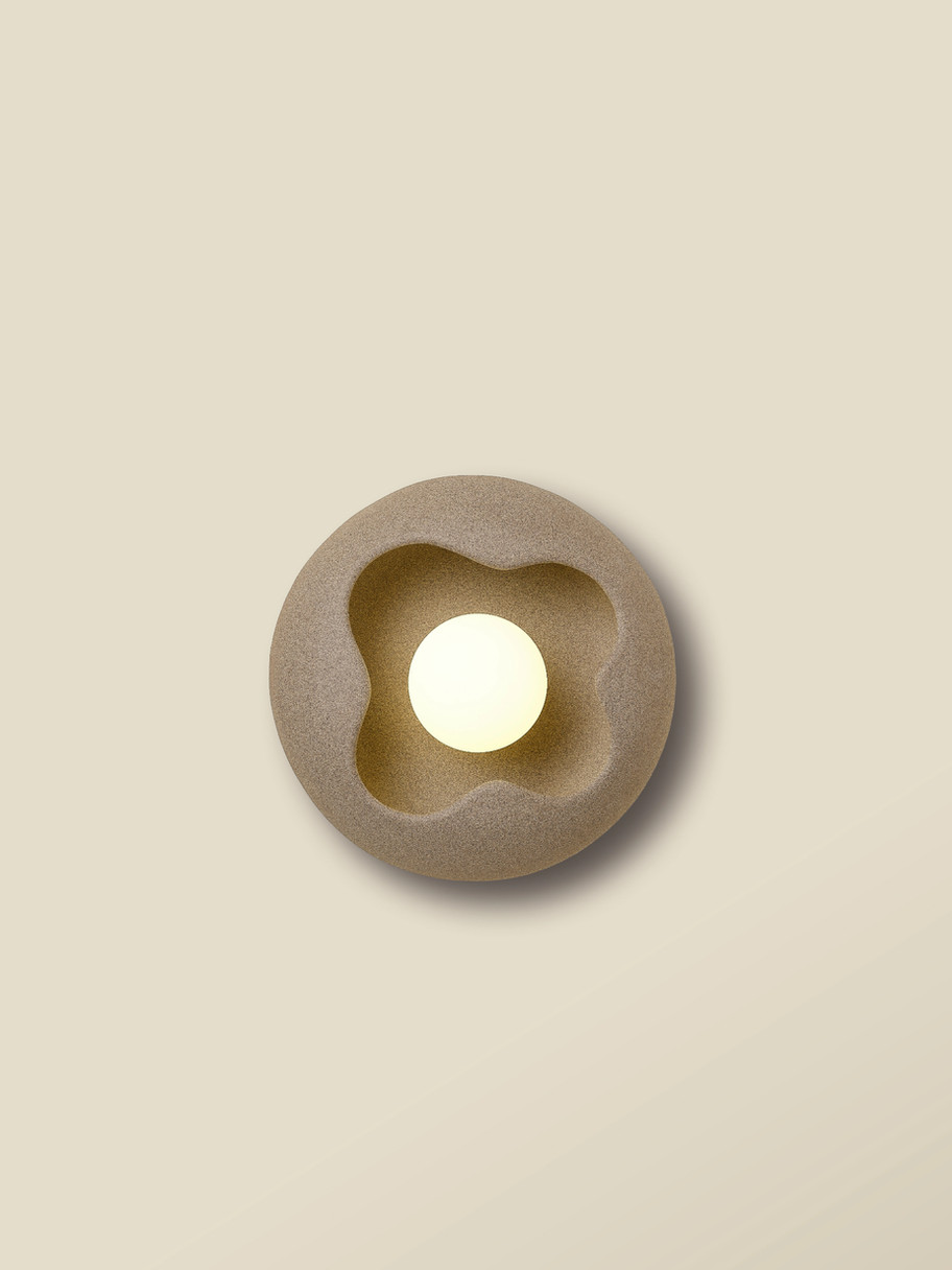 BUD ceramic clay LED wall light styled in a minimalist bedroom, adding warmth and contemporary elegance.