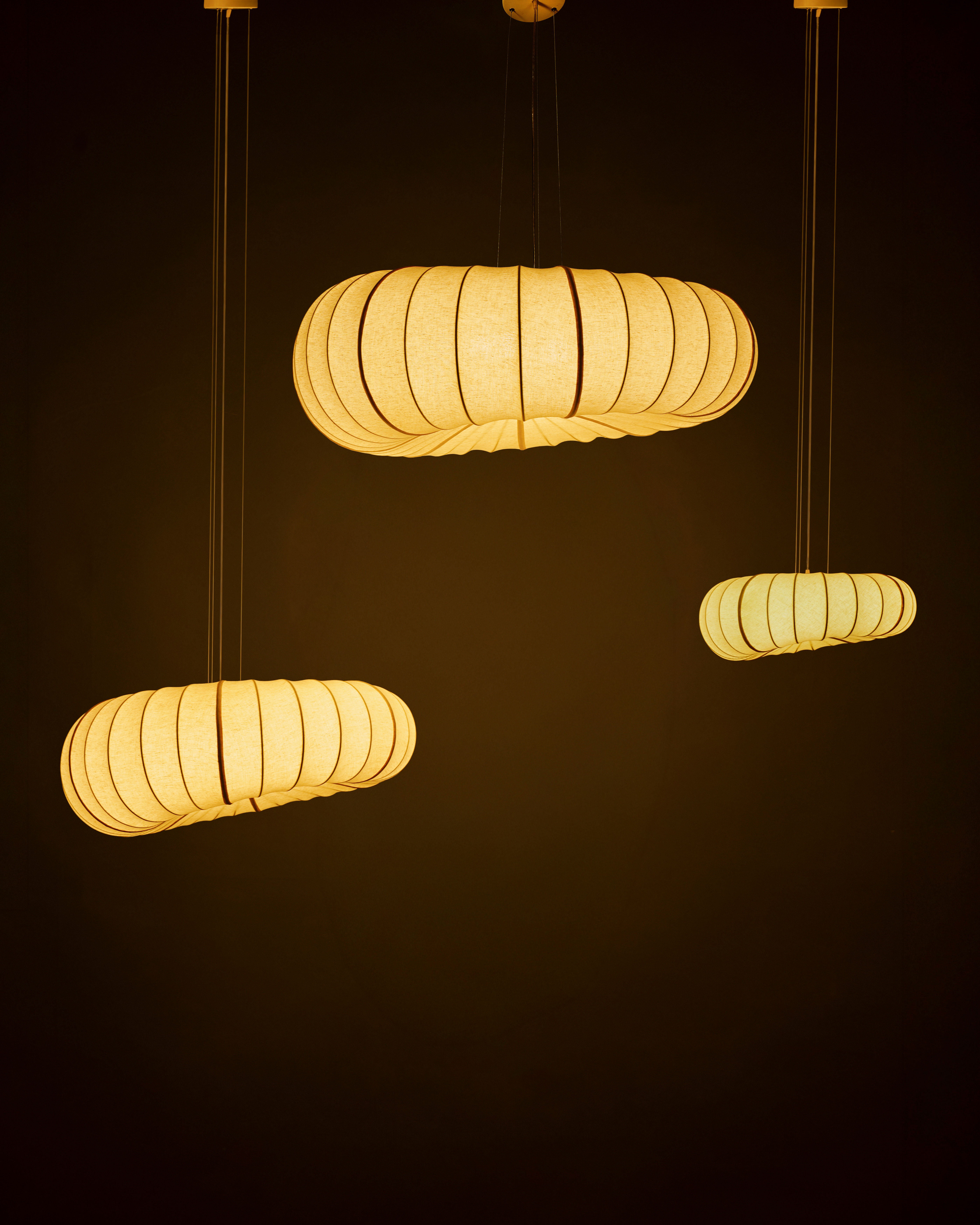Cluster set of 3 illuminated fabric POLO lamps, perfect as a warm dining chandelier or bedroom ceiling light.