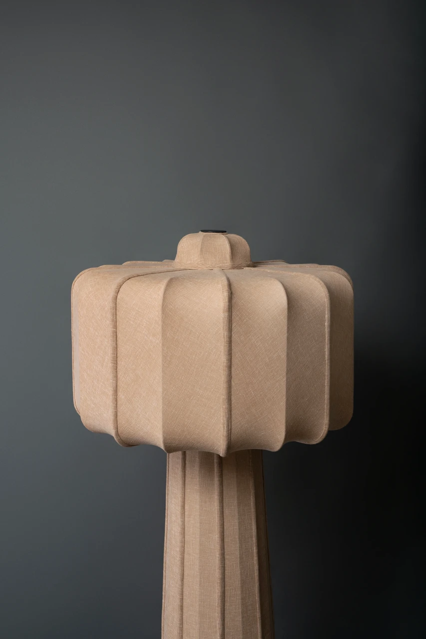 Close-up view of VALO taupe sculptural fabric floor lamp shade, a minimal design for luxury interiors.