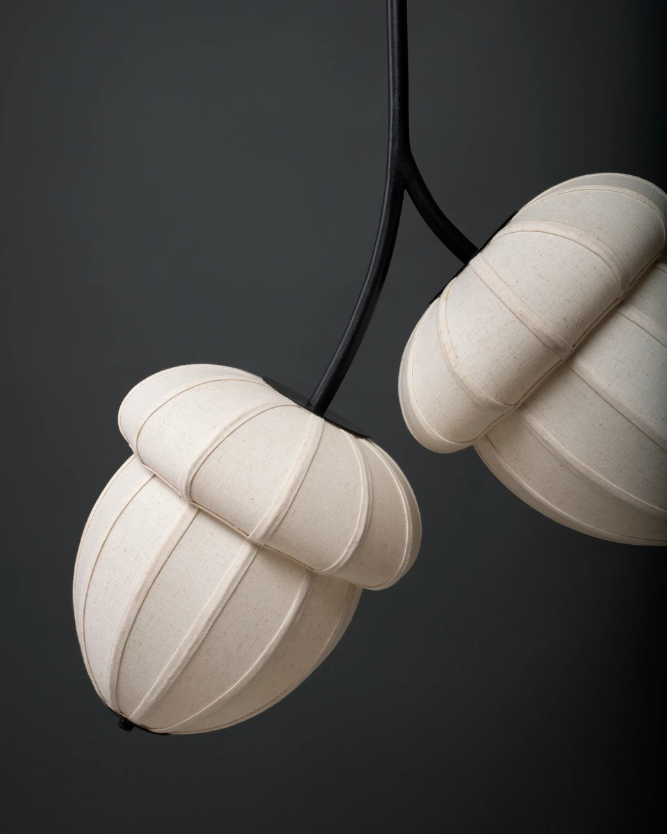 Close-up of unlit ACORNS Pendant Lamp. Sculptural fabric hanging light featuring an organic design.