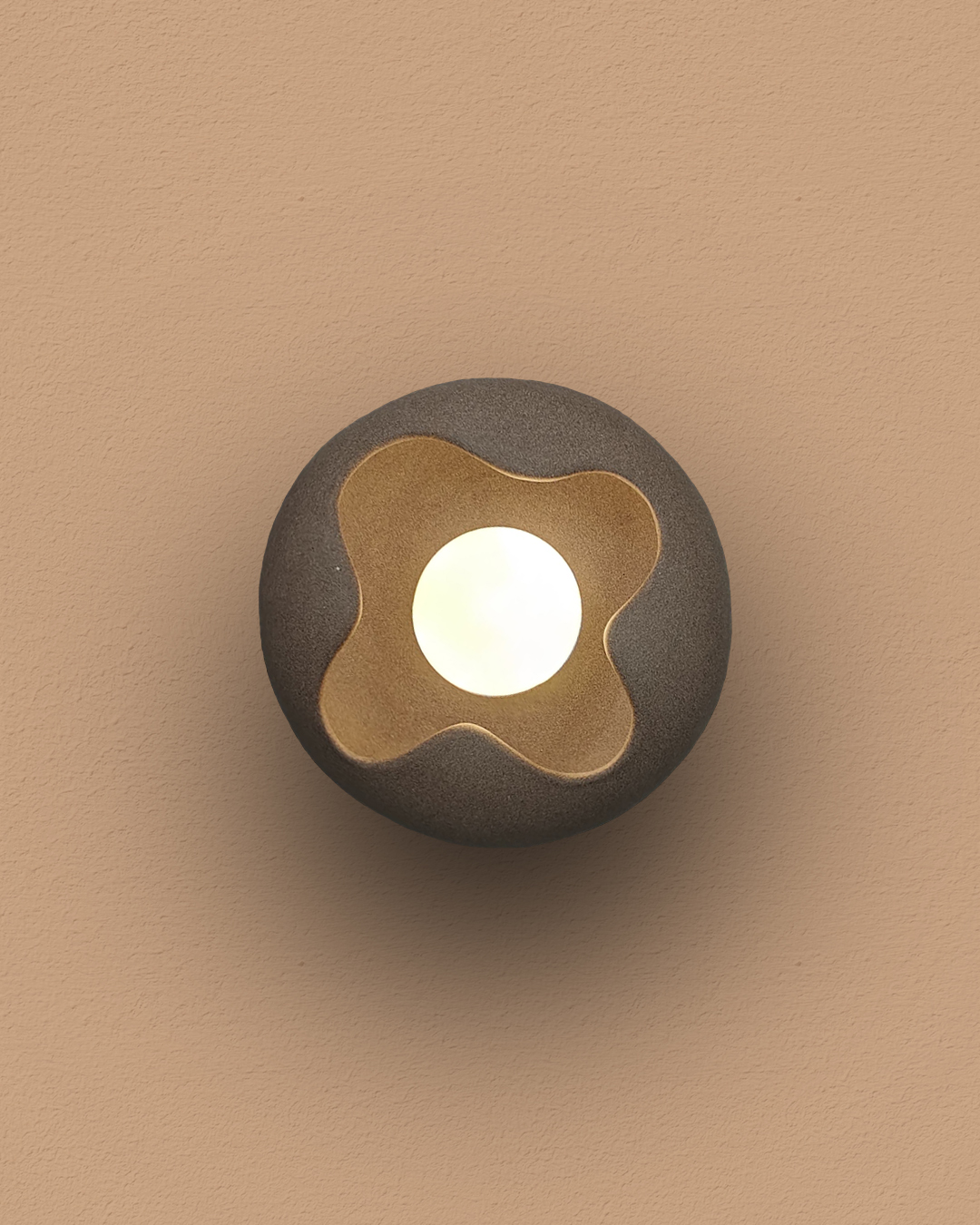 BUD ceramic clay LED wall light styled in a minimalist bedroom, adding warmth and contemporary elegance.