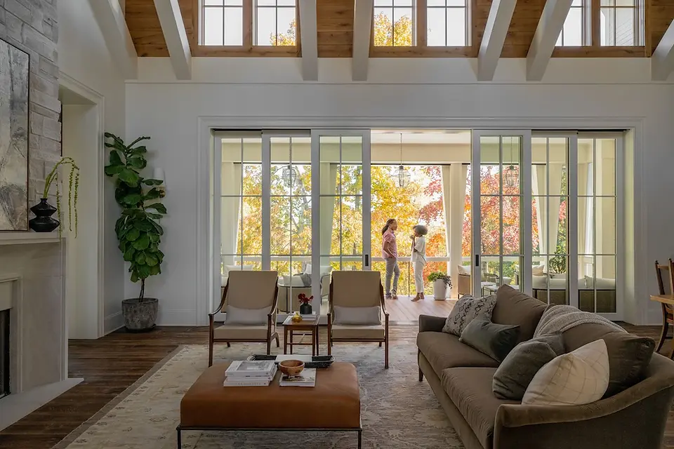 Patio doors along with windows placed high on the wall offer lots of light for this living area