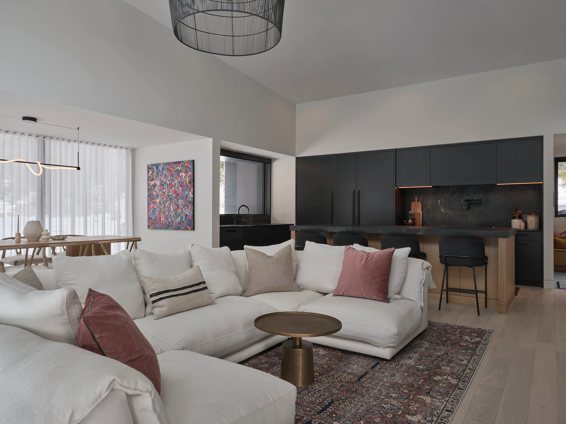 Sunnybrook sanctuary custom home interior living room sofa overlooking the kitchen and dining areas