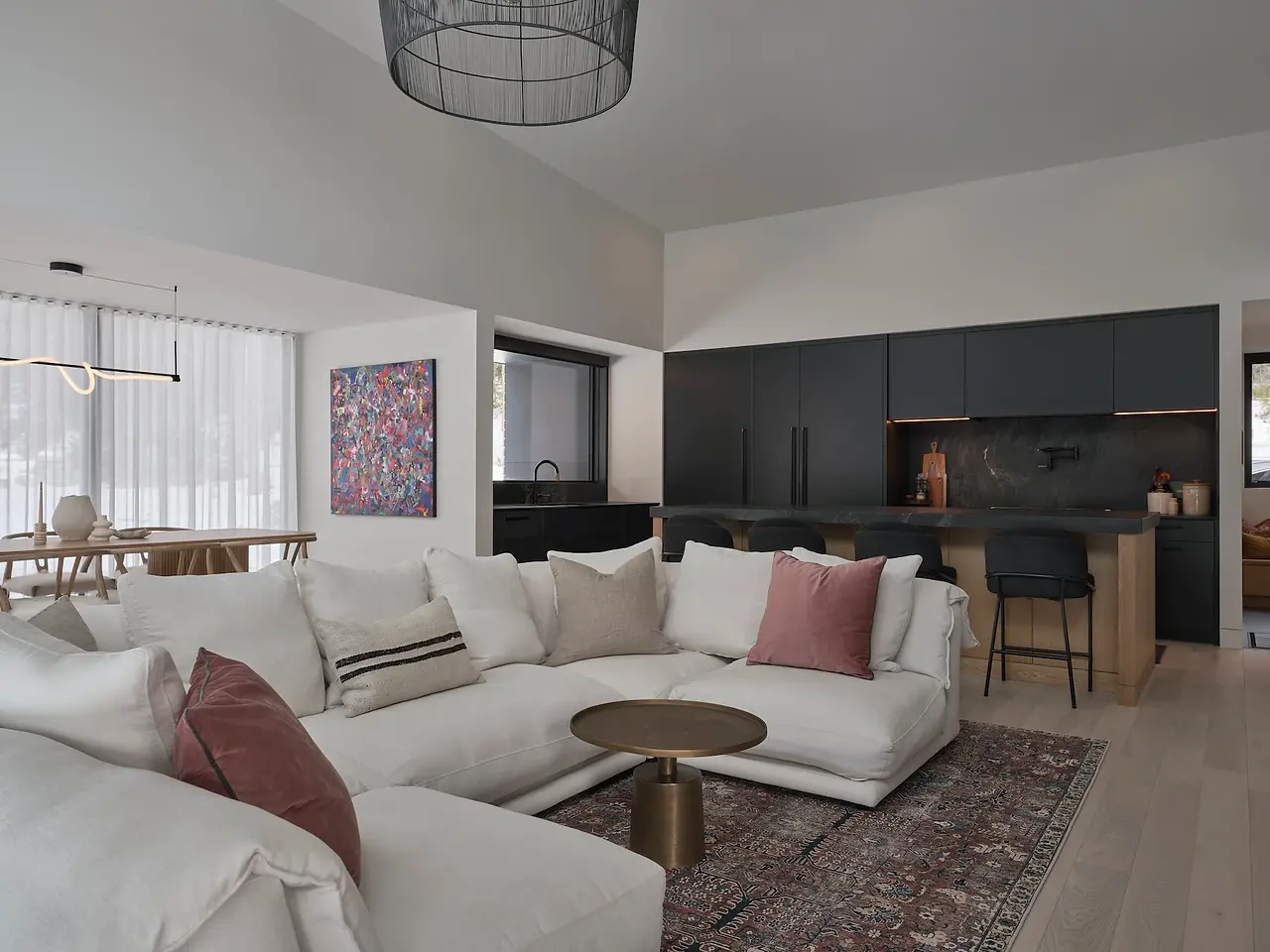 Sunnybrook sanctuary custom home interior living room sofa overlooking the kitchen and dining areas