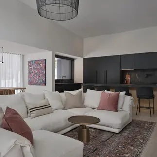 Sunnybrook sanctuary custom home interior living room sofa overlooking the kitchen and dining areas