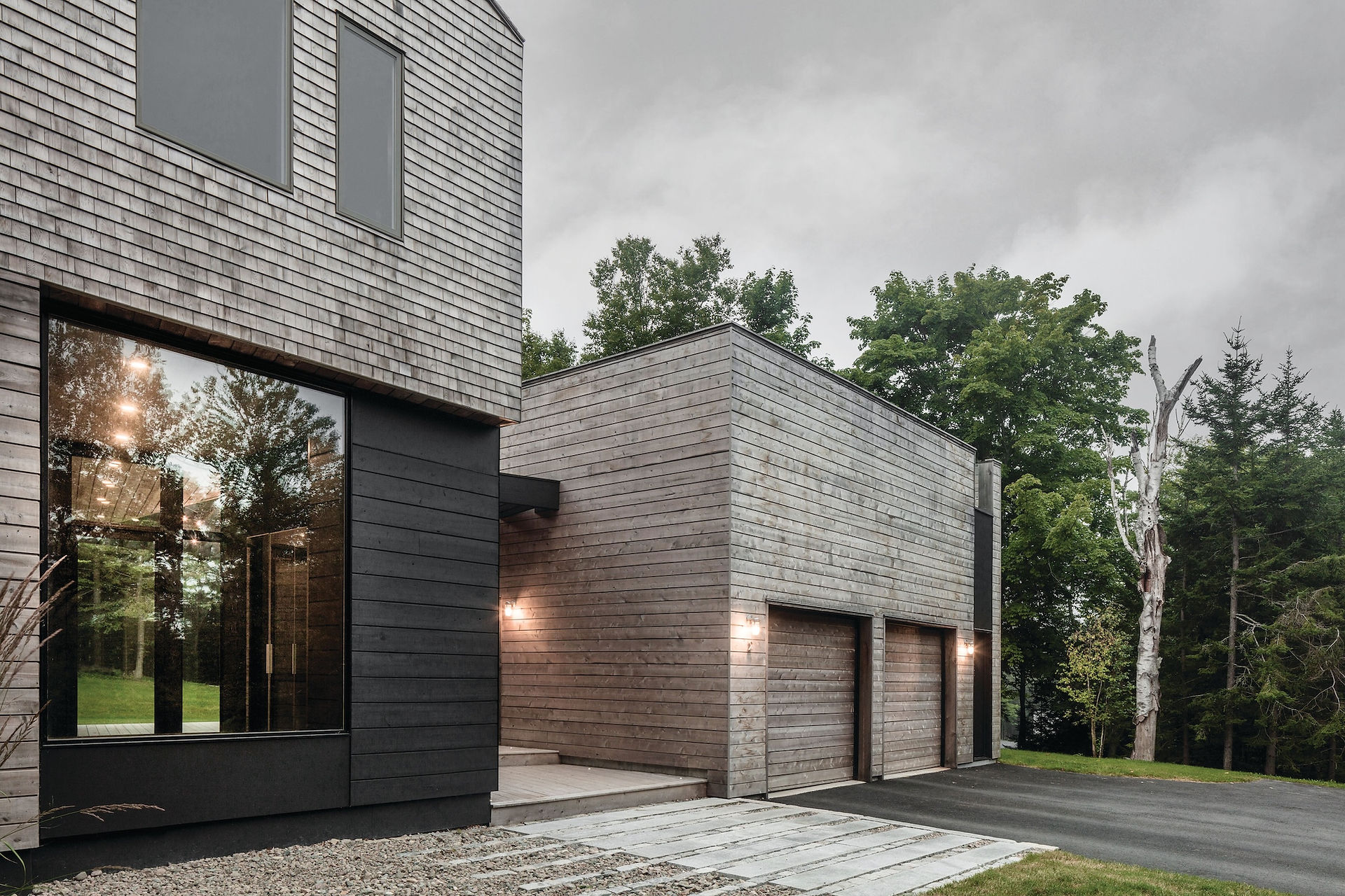 Modern home featuring black windows by Marvin