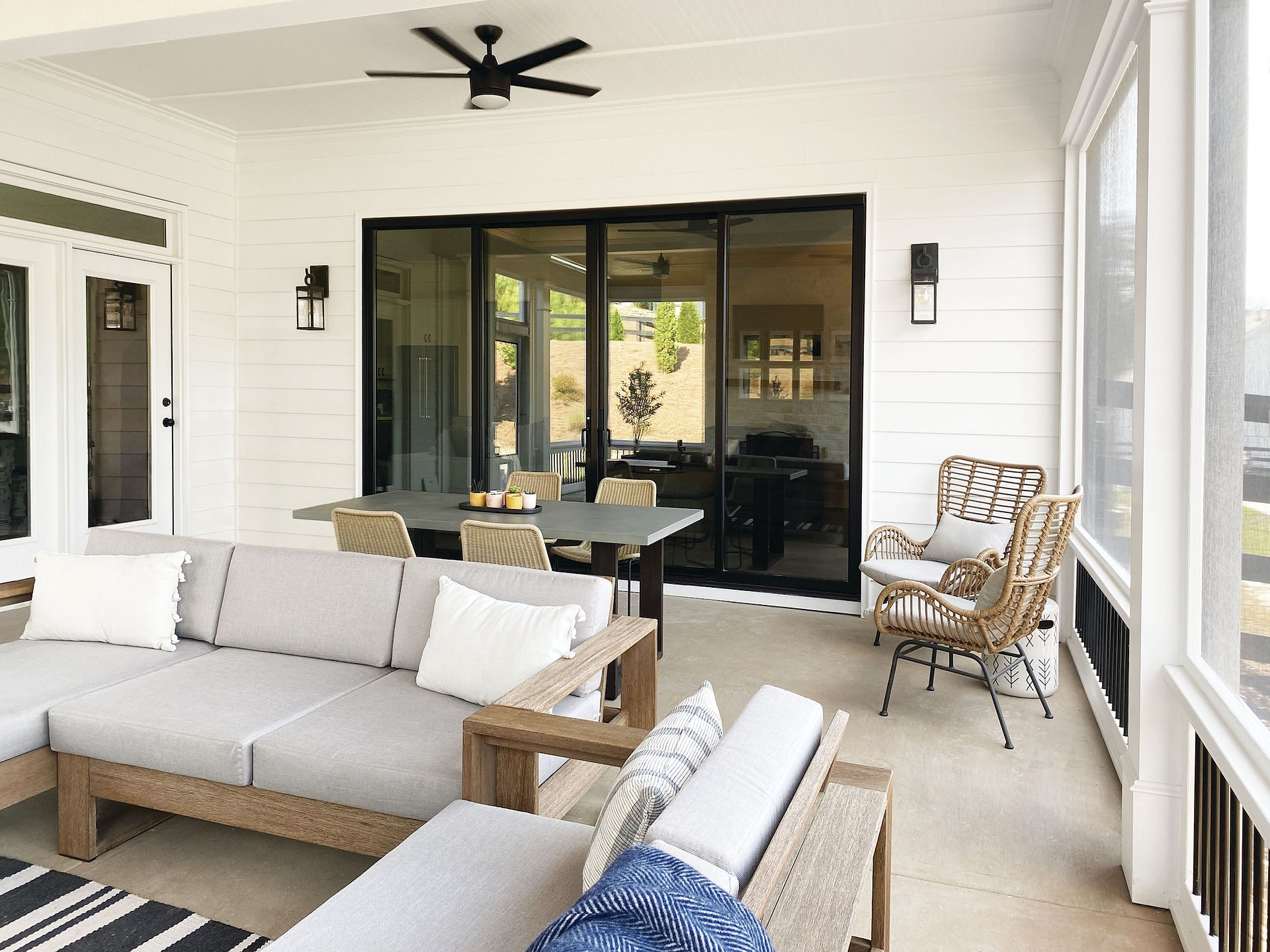 Modern home featuring black windows and sliding patio doors by Marvin