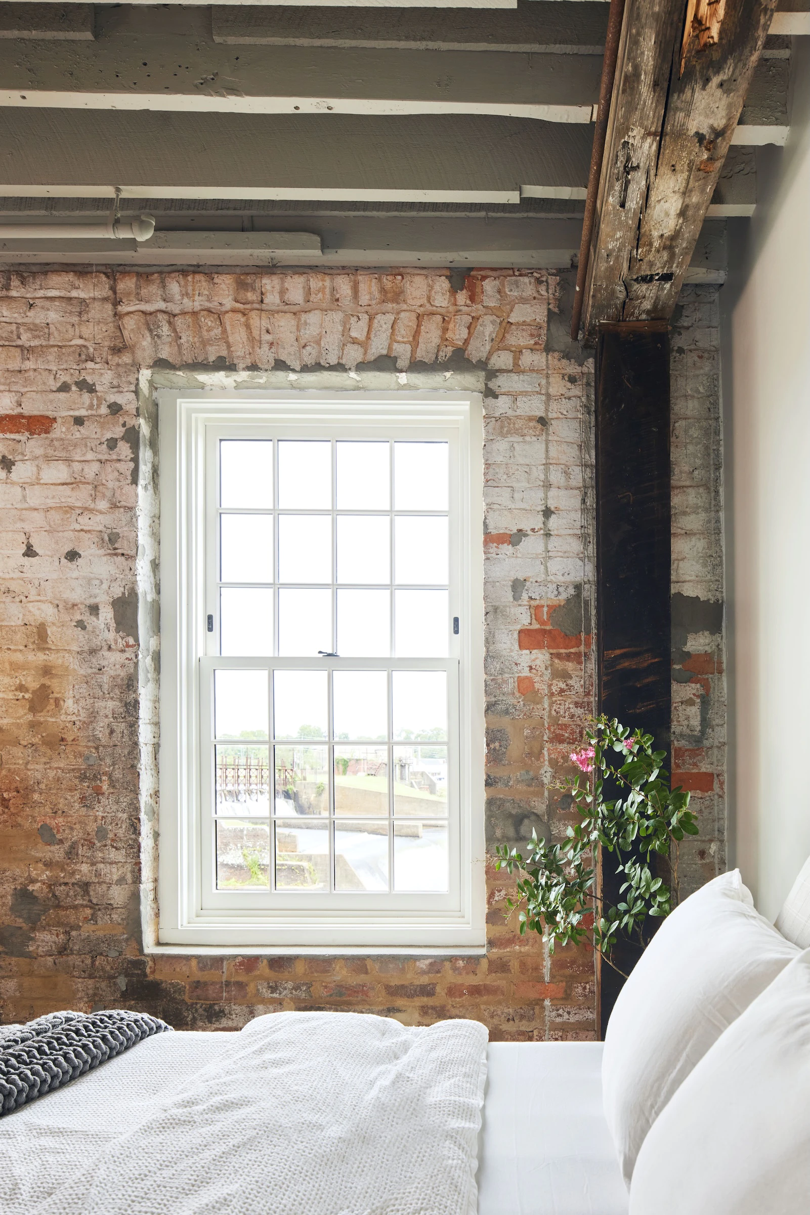 Brick heritage building with Marvin Double-Hung window in white.