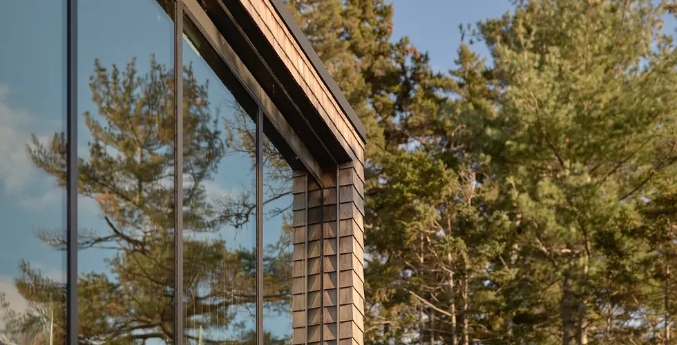 Sunnybrook Sanctuary custom home exterior close up of Marvin picture windows and cedar siding surround