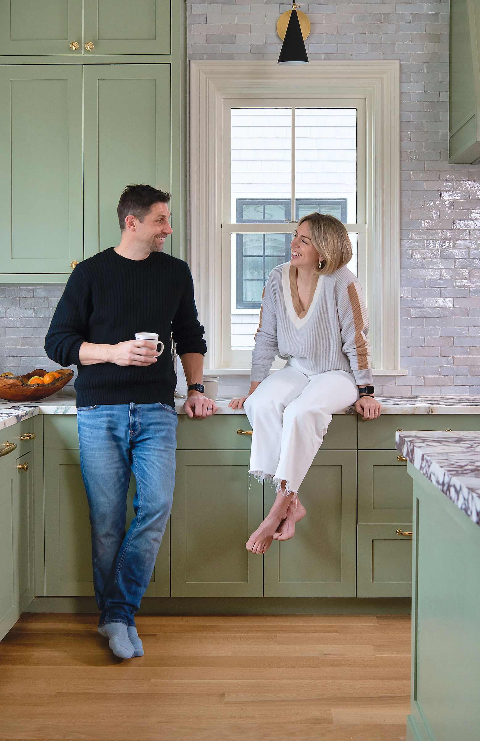 Couple enjoying renovated heritage home in the kitchenen