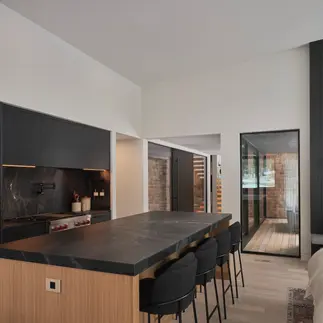 Sunnybrook sanctuary custom home interior kitchen island overlooking the patio
