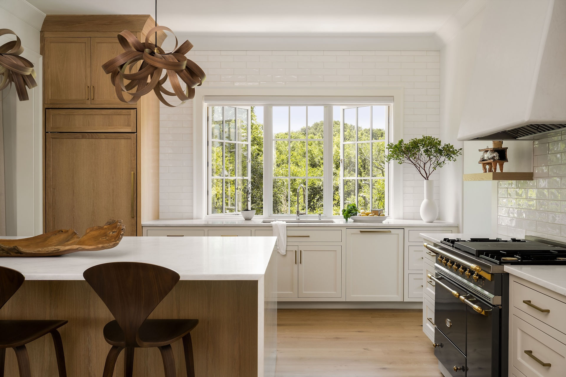 Picture and flanker casement windows in a Canadian kitchen maximizing ventilation and light