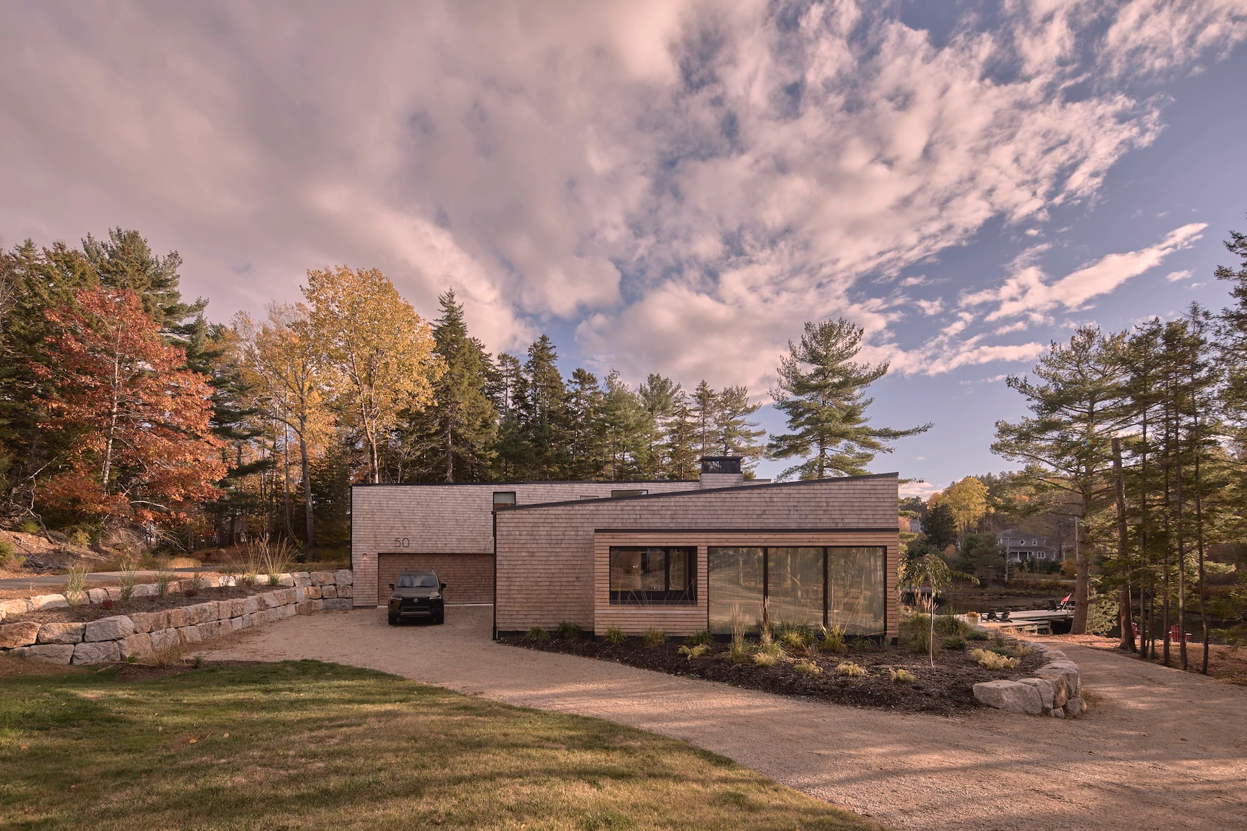 Sunnybrook Sanctuary custom home exterior driveway and dining room with cedar shingles