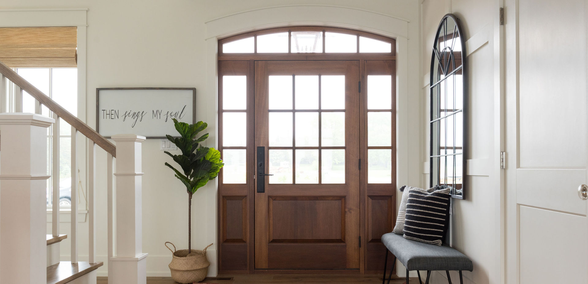 Marvin Entry door in dark stained wood with sidelights and transom window in Rothsay, New Brunswick.