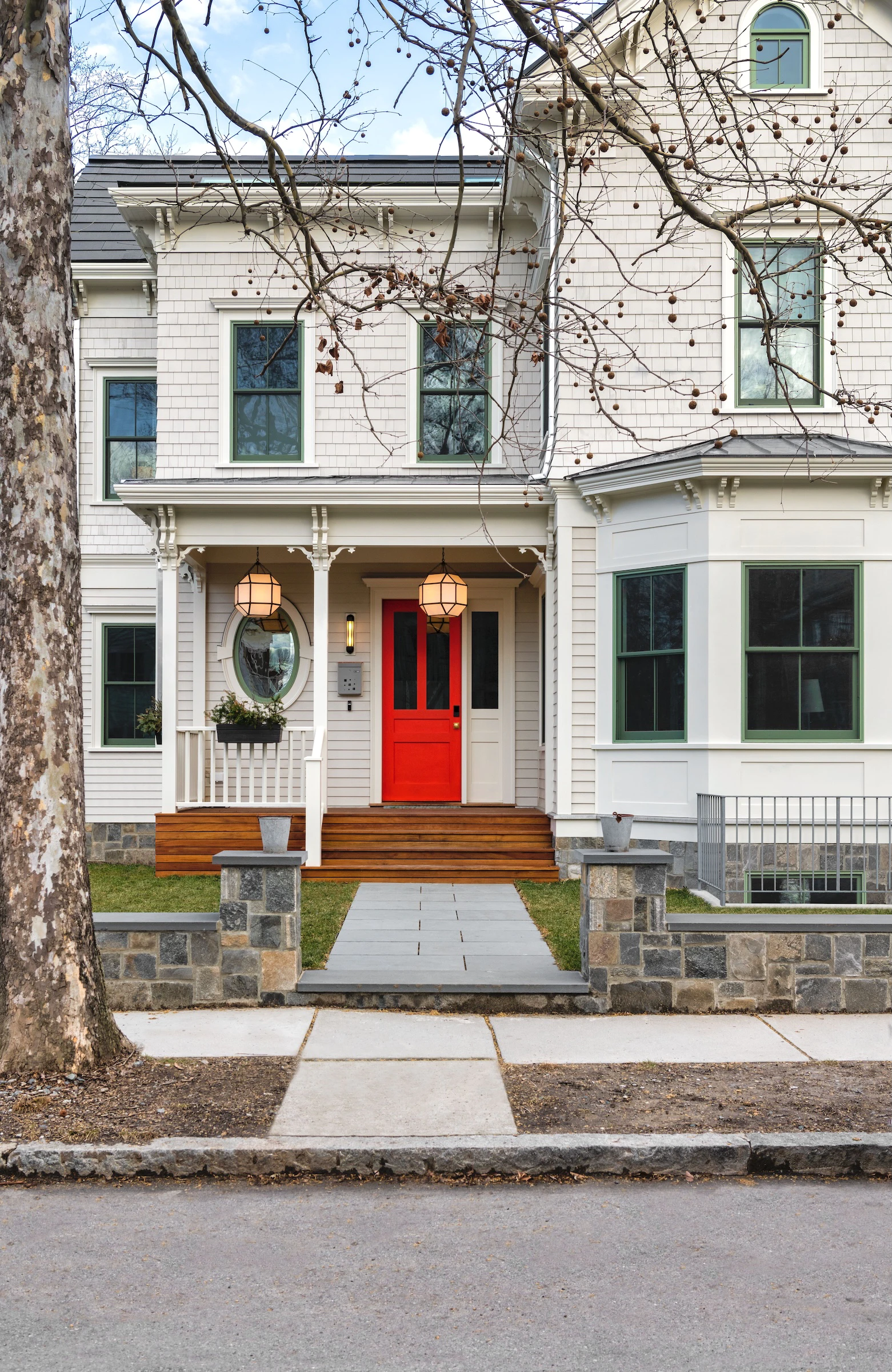 Exterior of renovated East Coast heritage home with red front door